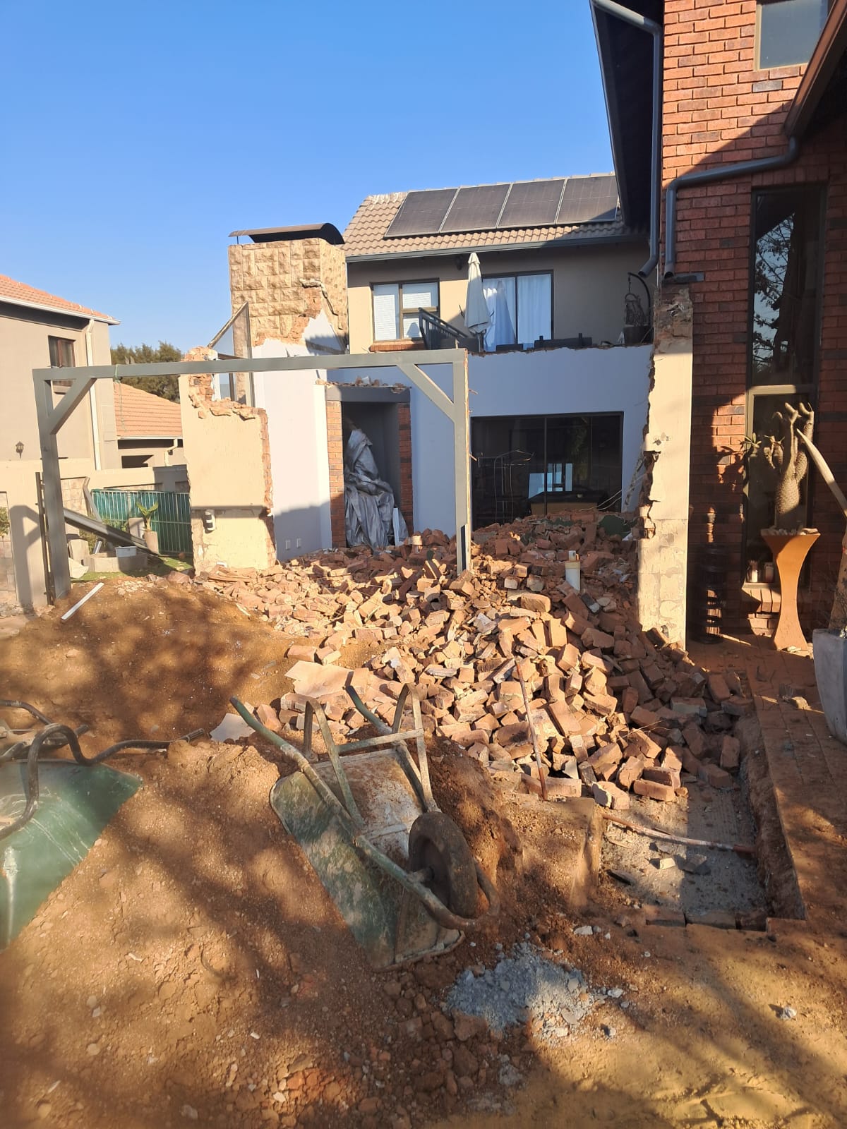 Wall demolition and rubble on a Pretoria home site